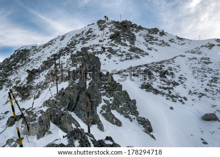 climbers walking down  in line in the Mountain of Rila at the peak of Musala