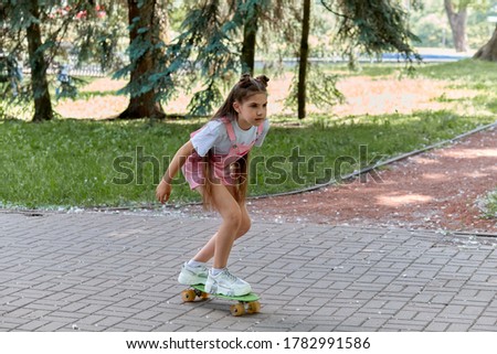 An exciting hobby is skateboarding. Girl and skateboard. Sports lifestyle.