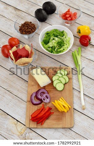 Meal kit fresh ingredients laid out in decorative arrangement ready for preparing at home gourmet healthy taco salad dinner