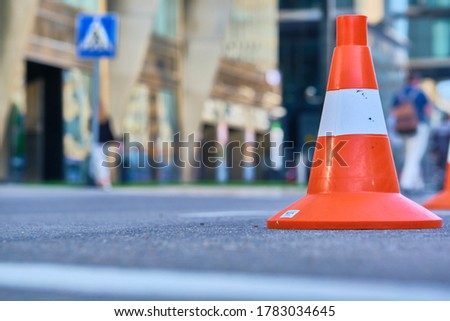 traffic cones stand on the asphalt