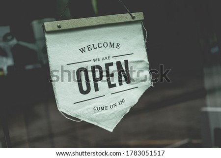 Open sign in a business coffee shop ready to service after close covid-19 situation