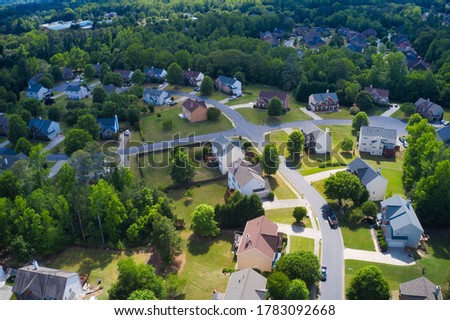 Aerial panoramic view of house cluster in a sub division in Suburbs  with golf course and lake in metro Atlanta in Georgia ,USA shot by drone shot during golden hour Royalty-Free Stock Photo #1783092668