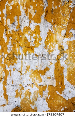 Grungy yellow stone wall artistic background