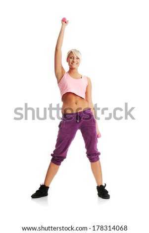 Young beautiful woman during fitness time and exercising with dumb-bell, isolated on white background