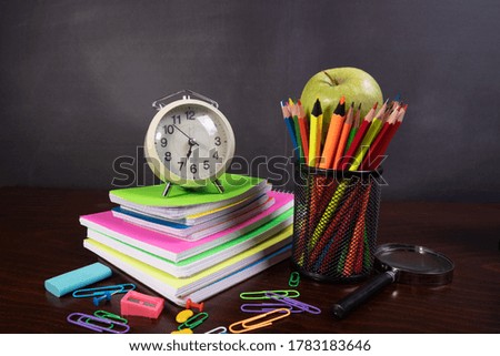 Back to School Concept with Stationery and Blackboard