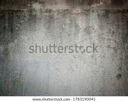 The texture of the old cement wall, painted white, has jagged marks. Is a vignette