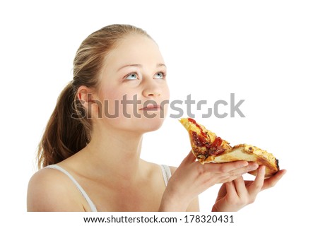 Young happy woman eating pizza, isolated on white 