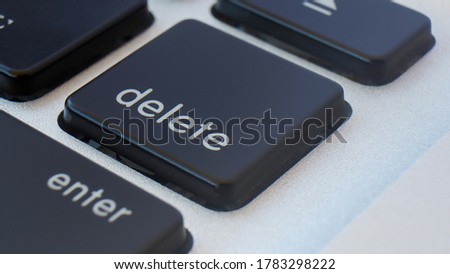 Close up the Delete key on the laptop keyboard