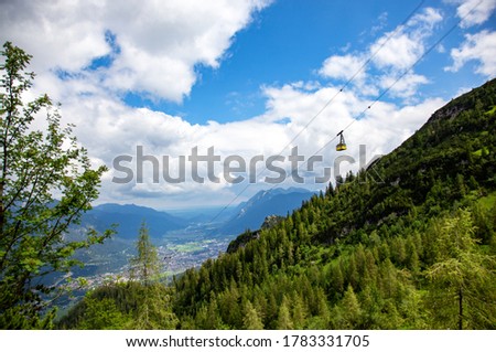 View of Garmisch-Partenkirchen Bavaria and Kreuzeckbahn - Kreuzeck Cable car and the Wank mountain in background. mountain range Estergebirge mountains. Eckenberg, views from the top of the hill. Royalty-Free Stock Photo #1783331705
