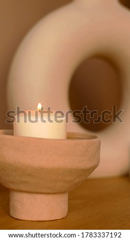 A photo of a decoratice candle in a designed room