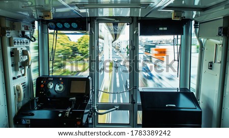 The suspened monorail system in Chiba, Japan, motion blurred view from inside the