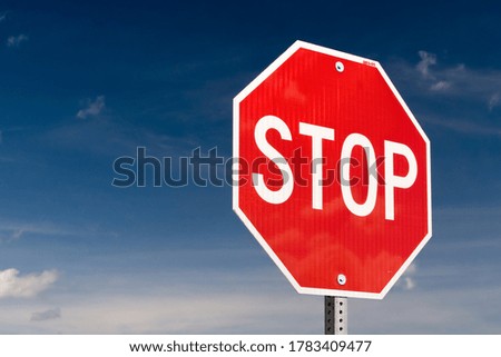 Stop sign with blue sky