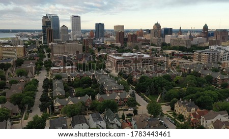 Bird's eye view of Downtown Milwaukee Wisconsin.  Aerial of the skyline from the north side of the city. Cloudy morning, summer