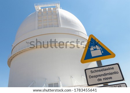 Astronomical Observatory in Calar Alto, Almeria, Spain. This is the bigger space observation site in continental Europe, with the biggest telescope. Sign says "Snowfall hazard" in German and Spanish
