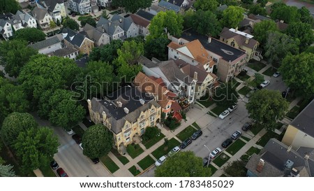 Aerial view of american neighborhood, houses nearby downtown Milwaukee, Wisconsin. Cloudy morning, summertime. 