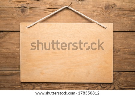 Signboard on the old wooden background  