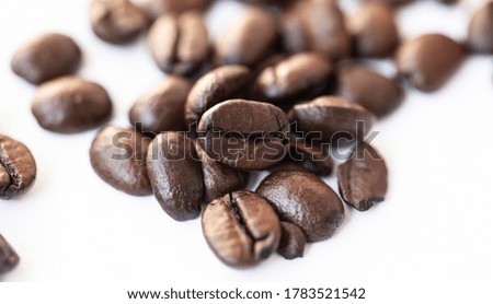 Half roasted coffee, isolated on white background.