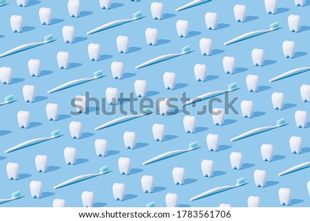 White teeth pattern on a blue paper background.