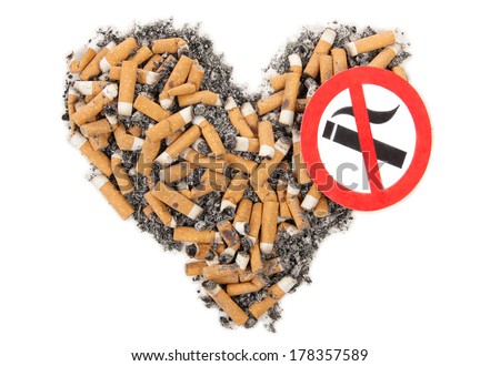 Broken heart and cigarette butt on a white background