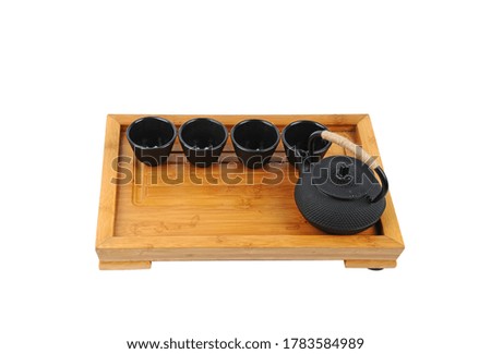 A set of Japanese cast iron teapots in a pure white background