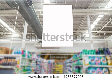 Blank advertising billboard hanging in the supermarket