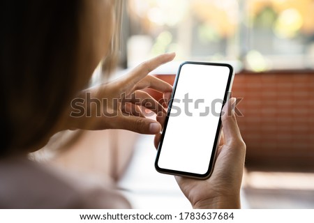 mock up phone in woman hand showing white screen Royalty-Free Stock Photo #1783637684
