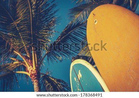Retro Aged Style Photo Of Surf Boards And Palm Trees Royalty-Free Stock Photo #178368491