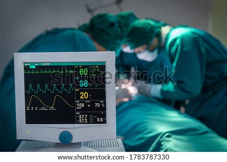 Operating room concept, Surgeons team working with Monitoring of patient in surgical operating room at hospital.