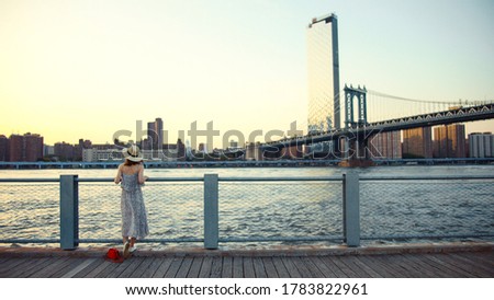 Young woman on the embankment in summer, New York