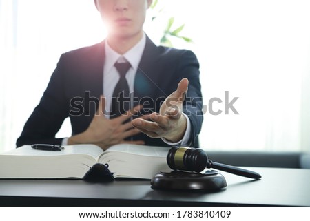 Lawyer welcoming hand at desk in office
