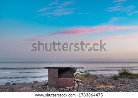 Fireplace for barbeque or warmth on sandcut beach British Columbia Canada