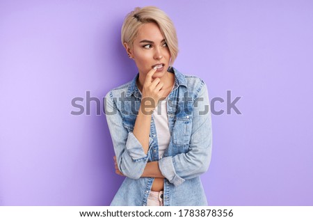 portrait of thoughtful trendy fashionable woman thinking. attractive lady in casual wear looks away