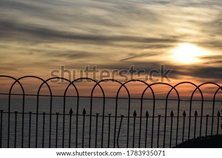 Beautiful picture of iron wall and sunset