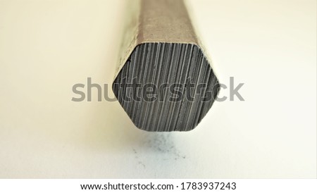Close-up texture of a slice of a graphite pencil.