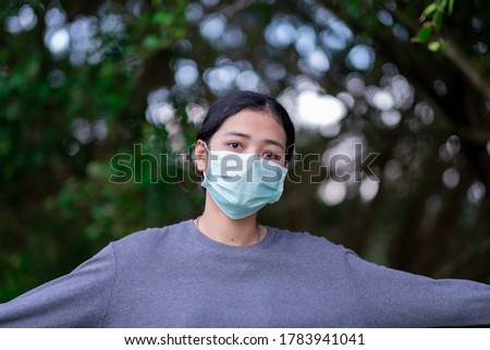 Young woman wearing medical face mask