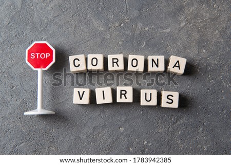 Stop sign and letters coronavirus, stop pandemie concept, top view