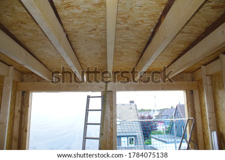 loft conversion with wooden ceiling beams