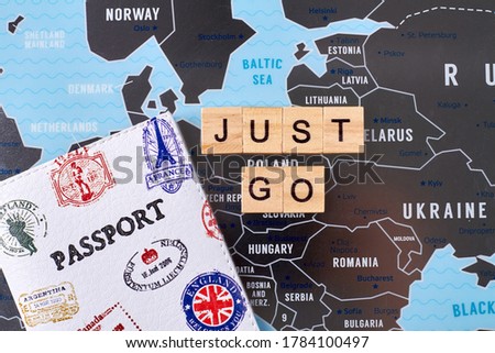 Passport with many stamps of different countries and just go slogan. Travel agency company advertising.