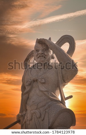 scenic sky weather with Chinese mythology deities statue in the foreground