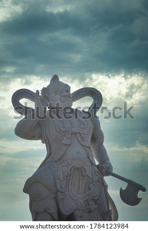 scenic sky weather with Chinese mythology deities statue in the foreground