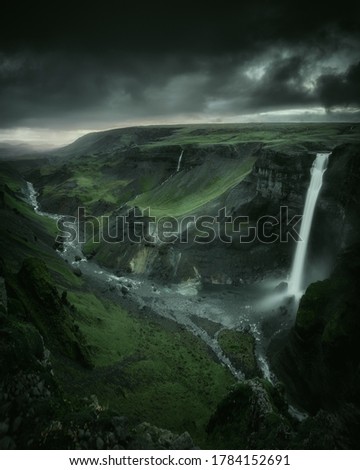 Haifoss waterfall in South Iceland in the dusk. Beautiful nature dramatic moody landscape. Panorama view. Color filter toned