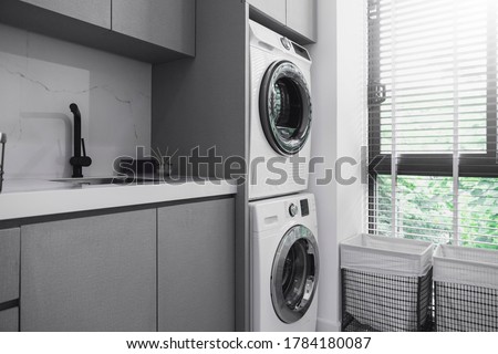 home interior design concept of Interior of A Modern Laundry Room with window wooden blind Royalty-Free Stock Photo #1784180087