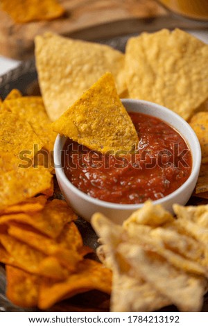 Chips close-up with salsa, rest and party snacks