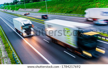Trucks on six lane controlled-access highway in Poland.
 Royalty-Free Stock Photo #1784217692