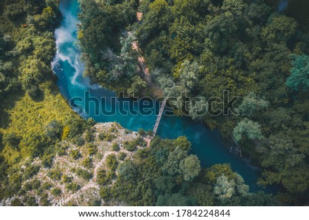 Top view of Panega river flowing through around the rocks, near Lukovit, Bulgaria. Drone photography