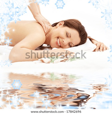 picture of lovely lady taking massage on white sand