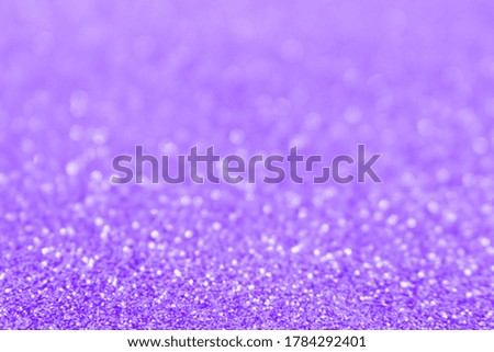 Purple glittering blur background. Festive defocused backdrop. 
