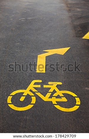 Bicycle lane sign on asphalt surface