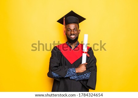 African American man college graduate isolated on yellow background