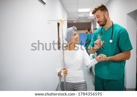 Woman with cancer during chemotherapy recovering from illness in hospital Royalty-Free Stock Photo #1784356595